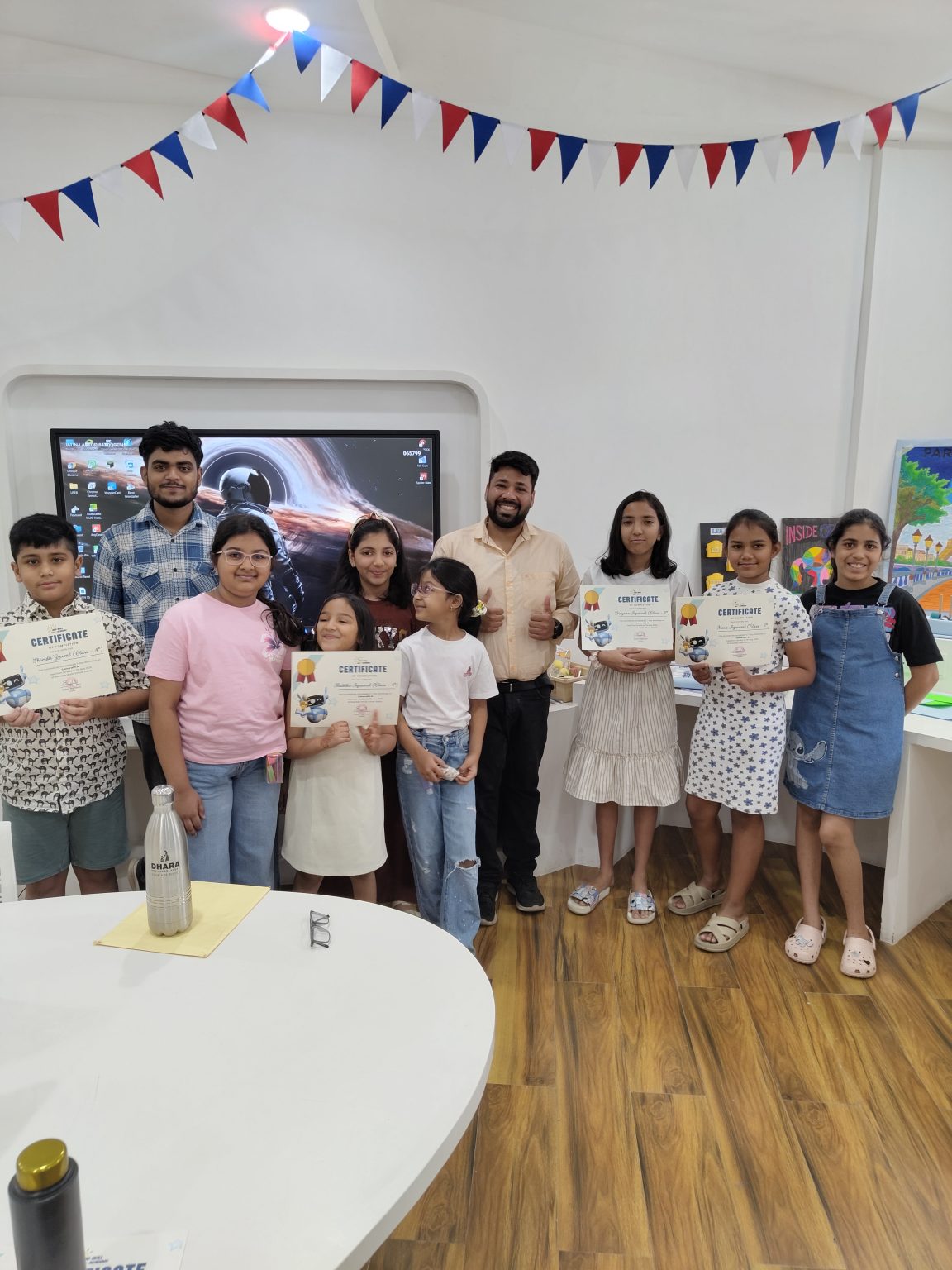 Young learners with achievement certificates